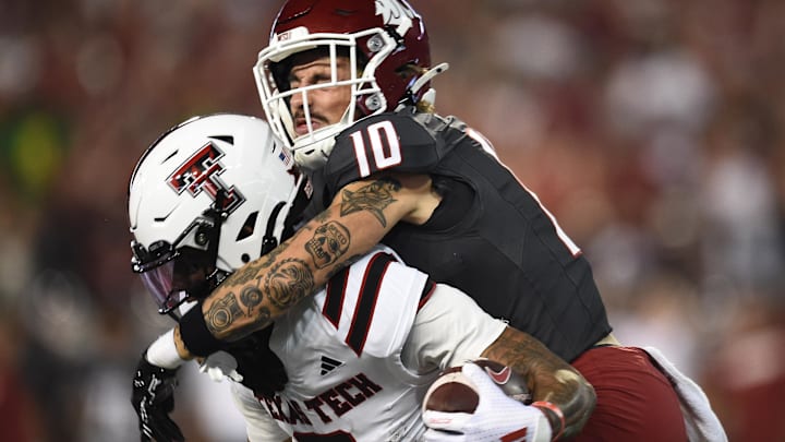 Sep 7, 2024; Pullman, Washington, USA; Texas Tech Red Raiders running back Cam'Ron Valdez (0) is caught from behind by Washington State Cougars defensive back Leyton Smithson (10) in the first half at Gesa Field at Martin Stadium. Mandatory Credit: James Snook-Imagn Images