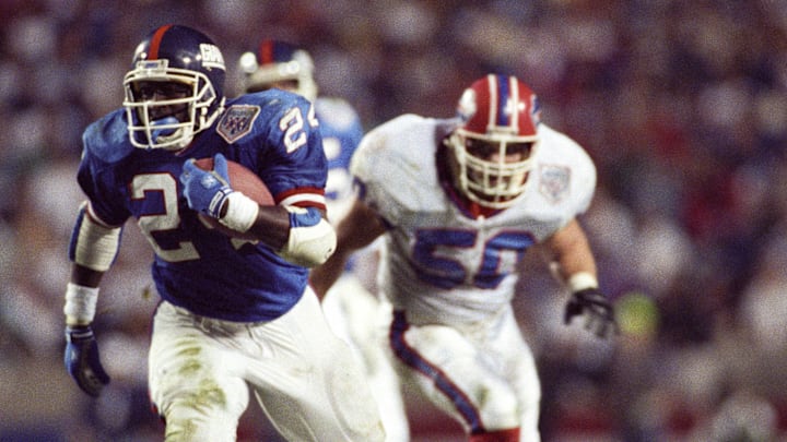 Jan 27, 1991; Tampa, FL, USA; FILE PHOTO; New York Giants running back Ottis Anderson (24) carries the ball during Super Bowl XXV at Tampa Stadium. The Giants defeated the Bills 19-20. Jan 27, 1991; Tampa, FL, USA; FILE PHOTO; New York Giants running back Ottis Anderson (24) carries the ball during Super Bowl XXV at Tampa Stadium. The Giants defeated the Bills 19-20.