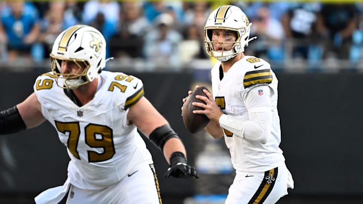 Saints center Luke Fortner (79) blocks in the fourth quarter at Bank of America Stadium