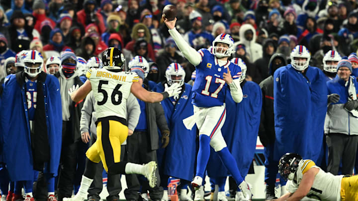 Jan 15, 2024; Orchard Park, New York, USA; Buffalo Bills quarterback Josh Allen (17) plays the ball in the second half against the Pittsburgh Steelers in a 2024 AFC wild card game