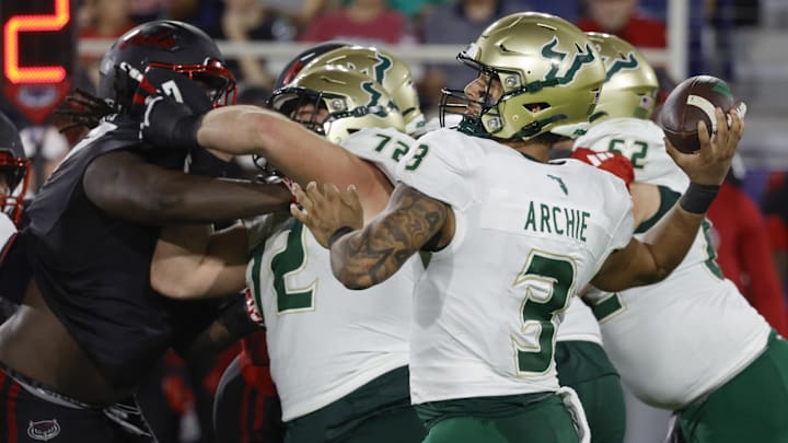 USF offensive lineman Cole Best (72)  gives quarterback Bruce Archie the time he needed for this pass last year against Florida Atlantic. Best is one of five returning offensive linemen for the Bulls.