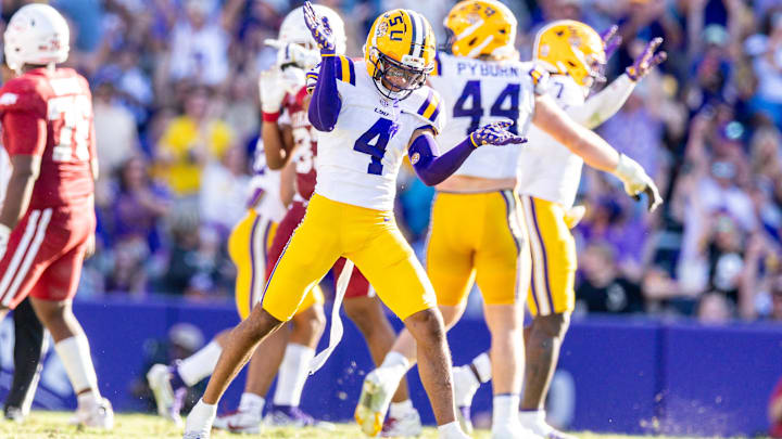 Nov 15, 2025; Baton Rouge, Louisiana, USA;  LSU Tigers cornerback Mansoor Delane (4) reacts to a stop on fourth down against the Arkansas Razorbacks during the second half at Tiger Stadium. Mandatory Credit: Stephen Lew-Imagn Images