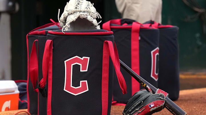 Mar 30, 2024; Oakland, California, USA; Cleveland Guardians equipment sits in front of the dugout before the game against the Oakland Athletics at Oakland-Alameda County Coliseum. Mandatory Credit: Darren Yamashita-Imagn Images