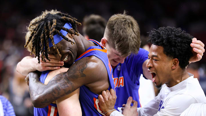 Denzel Aberdeen celebrates with teammates as the Florida Gators clinched the national championship.