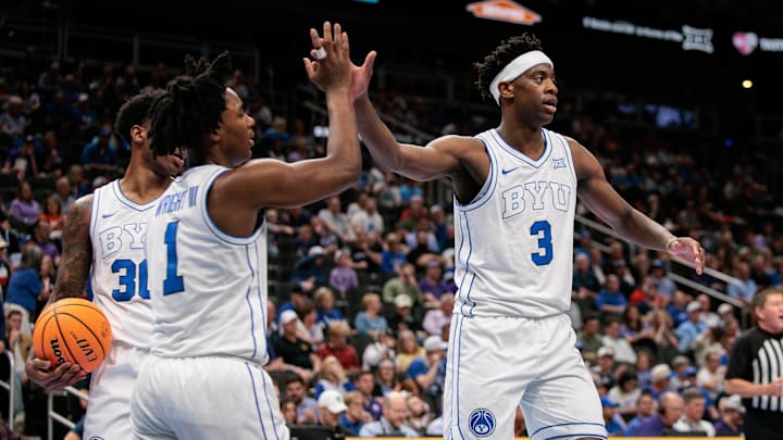 Mar 10, 2026; Kansas City, MO, USA; BYU Cougars forward AJ Dybantsa (3) slaps hands with BYU Cougars guard Robert Wright III (1) after a play during the second half against the Kansas State Wildcats at T-Mobile Center. Mandatory Credit: William Purnell-Imagn Images