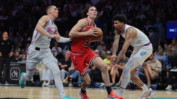 Mar 8, 2025; Miami, Florida, USA; Chicago Bulls guard Josh Giddey (3) drives to the basket past Miami Heat center Kel'el Ware (7) and guard Tyler Herro (14)