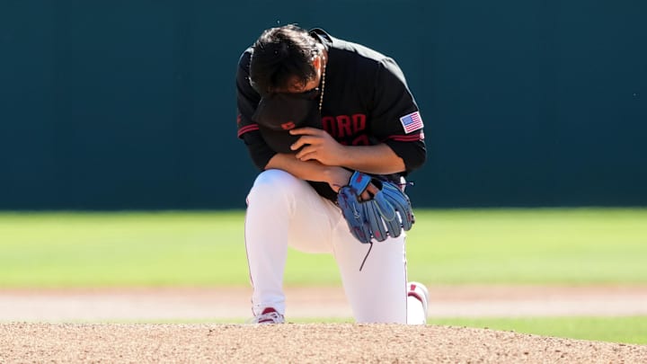 Mar 1, 2025; Stanford, CA, USA; Stanford Cardinal starting pitcher Christian Lim (42) kneels behind the mound before the game against the Xavier Musketeers at Sunken Diamond. Mandatory Credit: Darren Yamashita-Imagn Images Mar 1, 2025; Stanford, CA, USA; Stanford Cardinal starting pitcher Christian Lim (42) kneels behind the mound before the game against the Xavier Musketeers at Sunken Diamond. Mandatory Credit: Darren Yamashita-Imagn Images