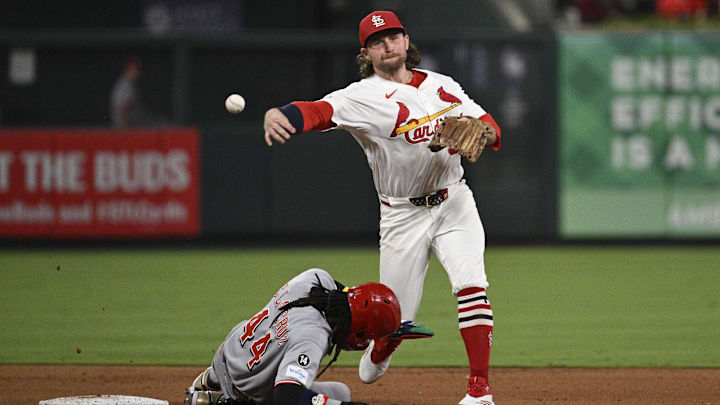 Sep 16, 2025; St. Louis, Missouri, USA; Cincinnati Reds shortstop Elly De La Cruz (44) is out at second base as St. Louis Cardinals second baseman Brendan Donovan (33) turns a double play in the fifth inning at Busch Stadium. Mandatory Credit: Joe Puetz-Imagn Images Sep 16, 2025; St. Louis, Missouri, USA; Cincinnati Reds shortstop Elly De La Cruz (44) is out at second base as St. Louis Cardinals second baseman Brendan Donovan (33) turns a double play in the fifth inning at Busch Stadium. Mandatory Credit: Joe Puetz-Imagn Images