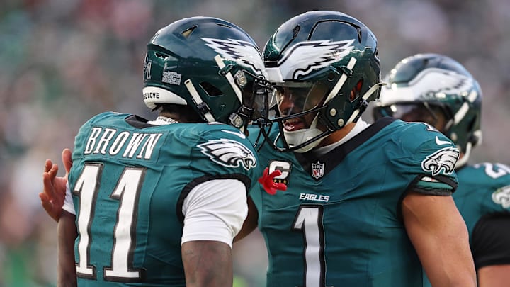 Philadelphia Eagles quarterback Jalen Hurts (1) and wide receiver A.J. Brown (11) celebrate after a touchdown against the Washington Commanders.