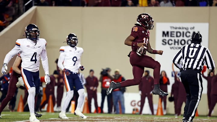 Nov 30, 2024; Virginia Tech quarterback William Watson III (18) scores a touchdown during the third quarter against Virginia. Nov 30, 2024; Virginia Tech quarterback William Watson III (18) scores a touchdown during the third quarter against Virginia.
