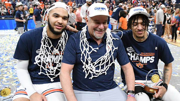 Mar 17, 2024; Nashville, TN, USA; Auburn Tigers head coach Bruce Pearl celebrates with his players after winning the SEC Championship.