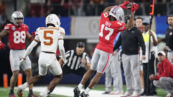 Ohio State Buckeyes wide receiver Carnell Tate (17) makes a sideline catch in front of Texas Longhorns defensive back Malik Muhammad (5) during the first half of the Cotton Bowl Classic College Football Playoff semifinal game at AT&T Stadium in Arlington, Texas on Jan. 10, 2025. Ohio State Buckeyes wide receiver Carnell Tate (17) makes a sideline catch in front of Texas Longhorns defensive back Malik Muhammad (5) during the first half of the Cotton Bowl Classic College Football Playoff semifinal game at AT&T Stadium in Arlington, Texas on Jan. 10, 2025.