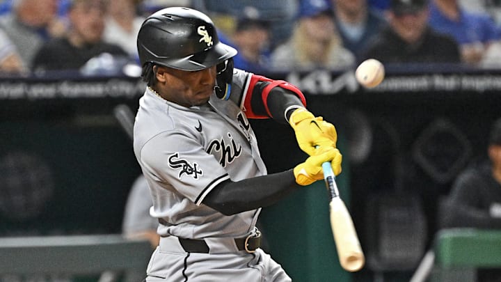 Apr 9, 2026; Kansas City, Missouri, USA;  Chicago White Sox center fielder Luisangel Acuna (0) drives in a run with a sacrifice fly in the seventh inning against the Kansas City Royals at Kauffman Stadium. Mandatory Credit: Peter Aiken-Imagn Images