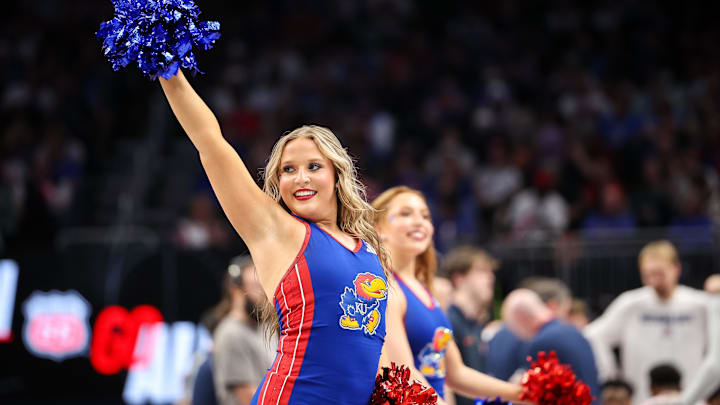 Mar 13, 2025; Kansas City, MO, USA; Kansas Jayhawks cheerleaders performs during the first half against the Arizona Wildcats at T-Mobile Center. Mandatory Credit: William Purnell-Imagn Images