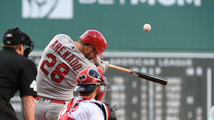 May 12, 2023; Boston, Massachusetts, USA; St. Louis Cardinals third baseman Nolan Arenado (28) hits a two run home run against the Boston Red Sox during the first inning at Fenway Park. Mandatory Credit: Eric Canha-Imagn Images