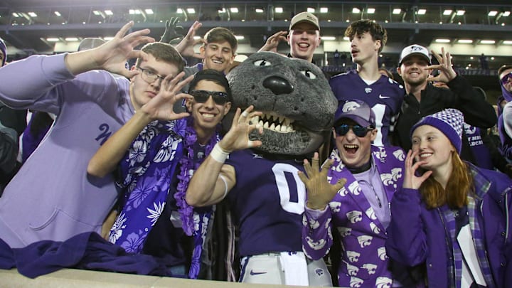 Nov 23, 2024; Manhattan, Kansas, USA; Kansas State Wildcats Willie Wildcat celebrates with fans following a win against the Cincinnati Bearcats at Bill Snyder Family Football Stadium. Mandatory Credit: Scott Sewell-Imagn Images