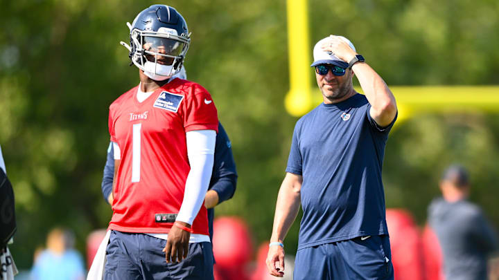 Jul 24, 2025; Nashville, TN, USA;  Tennessee Titans head coach Brian Callahan and quarterback Cameron Ward (1) talk during a break during training camp at Ascension Saint Thomas Sports Park. Mandatory Credit: Steve Roberts-Imagn Images