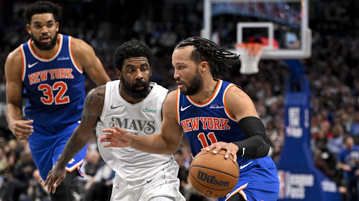 Nov 27, 2024; Dallas, Texas, USA; New York Knicks center Karl-Anthony Towns (32) and guard Jalen Brunson (11) and Dallas Mavericks guard Kyrie Irving (11) in action during the game between the Dallas Mavericks and the New York Knicks at the American Airlines Center. Mandatory Credit: Jerome Miron-Imagn Images Nov 27, 2024; Dallas, Texas, USA; New York Knicks center Karl-Anthony Towns (32) and guard Jalen Brunson (11) and Dallas Mavericks guard Kyrie Irving (11) in action during the game between the Dallas Mavericks and the New York Knicks at the American Airlines Center. Mandatory Credit: Jerome Miron-Imagn Images
