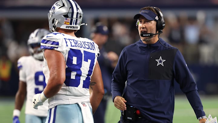 Dallas Cowboys head coach Brian Schottenheimer reacts with tight end Jake Ferguson.