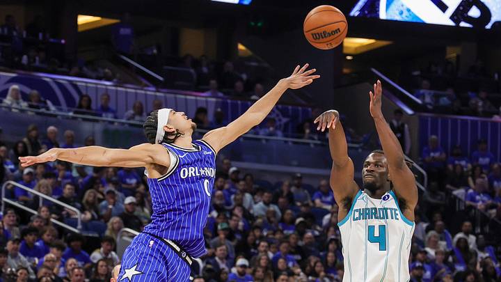 Apr 17, 2026; Orlando, Florida, USA; Charlotte Hornets guard Sion James (4) shoots against Orlando Magic guard Anthony Black (0) during the second half during the play-in rounds of the 2026 NBA Playoffs at Kia Center. Mandatory Credit: Mike Watters-Imagn Images Apr 17, 2026; Orlando, Florida, USA; Charlotte Hornets guard Sion James (4) shoots against Orlando Magic guard Anthony Black (0) during the second half during the play-in rounds of the 2026 NBA Playoffs at Kia Center. Mandatory Credit: Mike Watters-Imagn Images