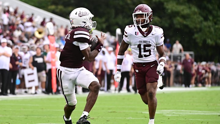 Aug 31, 2024; Starkville, Mississippi, USA; Mississippi State Bulldogs wide receiver Mario Craver (7) makes a reception against Eastern Kentucky Colonels defensive back Garnell Wilds Jr. (15) during a play that would result in a touchdown in the second quarter at Davis Wade Stadium at Scott Field. Mandatory Credit: Matt Bush-Imagn Images