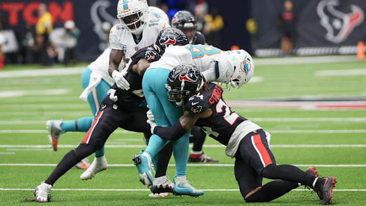 Miami Dolphins running back De'Von Achane (28) is tackled by Houston Texans cornerback Derek Stingley Jr. (24) in the first quarter at NRG Stadium. Miami Dolphins running back De'Von Achane (28) is tackled by Houston Texans cornerback Derek Stingley Jr. (24) in the first quarter at NRG Stadium.