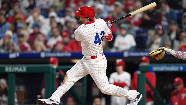Apr 15, 2025; Philadelphia, Pennsylvania, USA; Philadelphia Phillies designated hitter Kyle Schwarber (12) hits a single against the San Francisco Giants in the sixth inning at Citizens Bank Park. All players wore #42 for Jackie Robinson Day. 