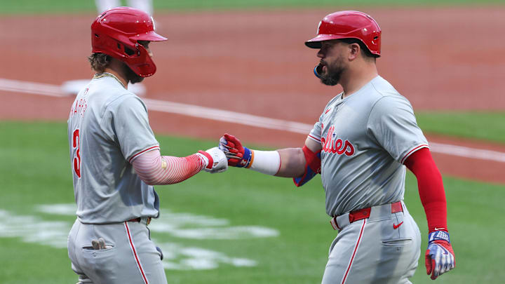 Jun 11, 2024; Boston, Massachusetts, USA; Philadelphia Phillies designated hitter Kyle Schwarber (12) celebrates with Philadelphia Phillies first baseman Bryce Harper (3) after a leadoff solo home run during the first inning against the Boston Red Sox at Fenway Park