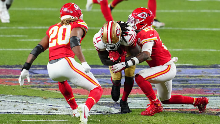 Feb 11, 2024; Paradise, Nevada, USA; San Francisco 49ers wide receiver Brandon Aiyuk (11) is tackled by Kansas City Chiefs safety Mike Edwards (21) in the fourth quarter in Super Bowl LVIII at Allegiant Stadium. Mandatory Credit: Stephen R. Sylvanie-Imagn Images