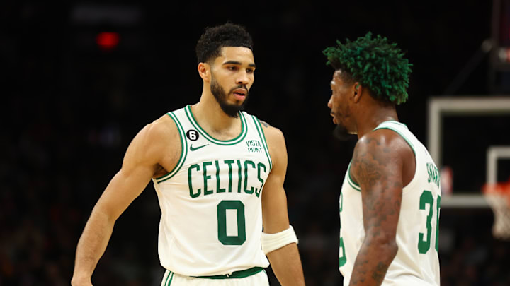 Dec 7, 2022; Phoenix, Arizona, USA; Boston Celtics forward Jayson Tatum (0) and guard Marcus Smart (36) against the Phoenix Suns at Footprint Center. Mandatory Credit: Mark J. Rebilas-Imagn Images
