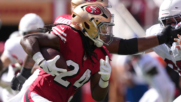 Oct 6, 2024; Santa Clara, California, USA; San Francisco 49ers running back Jordan Mason (24) carries the ball against the Arizona Cardinals during the second quarter at Levi's Stadium. Mandatory Credit: Darren Yamashita-Imagn Images Oct 6, 2024; Santa Clara, California, USA; San Francisco 49ers running back Jordan Mason (24) carries the ball against the Arizona Cardinals during the second quarter at Levi's Stadium. Mandatory Credit: Darren Yamashita-Imagn Images