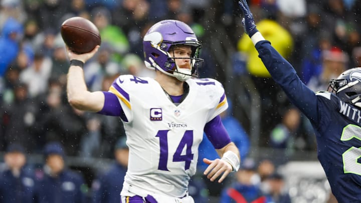 Dec 22, 2024; Seattle, Washington, USA; Minnesota Vikings quarterback Sam Darnold (14) passes against the Seattle Seahawks during the second quarter at Lumen Field. Dec 22, 2024; Seattle, Washington, USA; Minnesota Vikings quarterback Sam Darnold (14) passes against the Seattle Seahawks during the second quarter at Lumen Field.