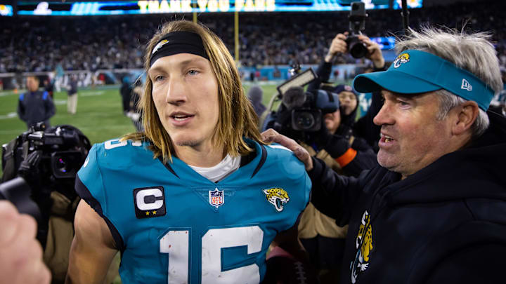 Jan 14, 2023; Jacksonville, Florida, USA; Jacksonville Jaguars quarterback Trevor Lawrence (16) celebrates with head coach Doug Pederson at TIAA Bank Field. Mandatory Credit: Mark J. Rebilas-USA TODAY Sports