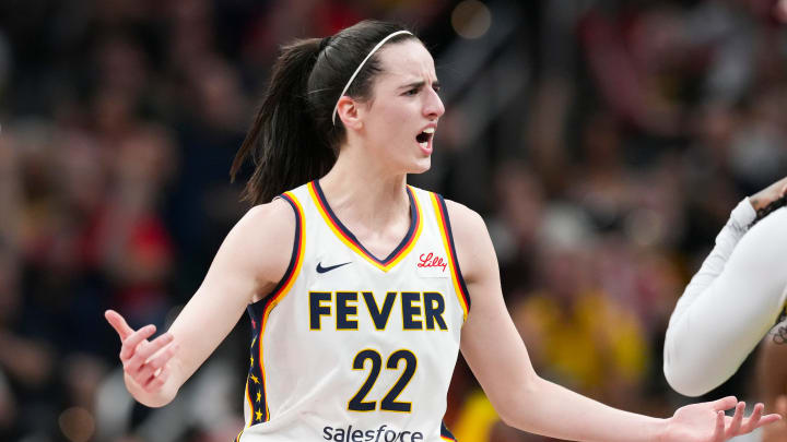 Indiana Fever guard Caitlin Clark (22) talks to Seattle Storm guard Victoria Vivians (35) following being run into after making a three-pointer, Thursday, May 30, 2024, during the WNBA game at Gainbridge Fieldhouse in Indianapolis.