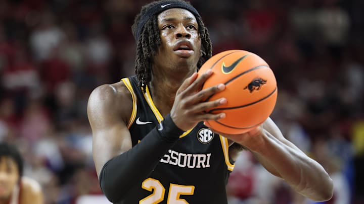 Feb 22, 2025; Fayetteville, Arkansas, USA; Missouri Tigers forward Mark Mitchell (25) shoots a free throw during the second half against the Arkansas Razorbacks at Bud Walton Arena. Mandatory Credit: Nelson Chenault-Imagn Images