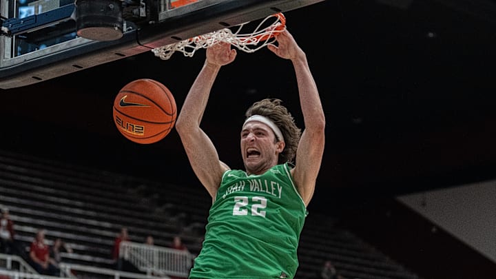 Dec 3, 2024; Stanford, California, USA; Utah Valley Wolverines forward Carter Welling (22) dunks the basketball against the Stanford Cardinal during the second half at Maples Pavilion. Mandatory Credit: Neville E. Guard-Imagn Images