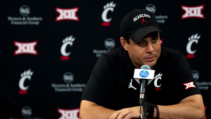 Cincinnati Bearcats head coach Wes Miller speaks at a podium at First Third Arena in Cincinnati on Wednesday, July 16, 2025.