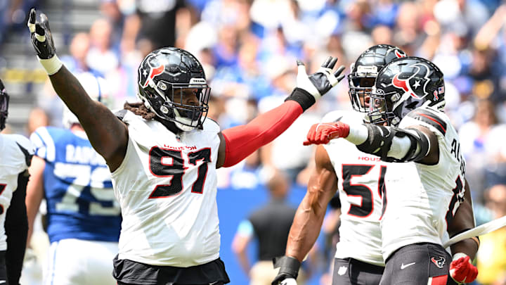 Sep 8, 2024; Indianapolis, Indiana, USA; Houston Texans defensive end Mario Edwards Jr. (97) celebrates a sack during the second quarter against the Indianapolis Colts at Lucas Oil Stadium. Mandatory Credit: Marc Lebryk-Imagn Images