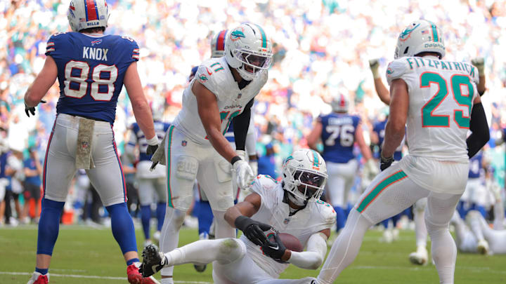 Miami Dolphins safety Ifeatu Melifonwu (9) celebrates with safety Dante Trader Jr. (11) and safety Minkah Fitzpatrick (29) after an interception against Buffalo Bills tight end Dawson Knox (88) during the second half at Hard Rock Stadium. 