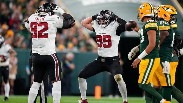 Sep 24, 2026; Green Bay, Wisconsin, USA;  Atlanta Falcons defensive end Cameron Thomas (99) celebrates with defensive lineman Maason Smith (92) after tackling Green Bay Packers quarterback Jordan Love (10) (not pictured) during the third quarter at Lambeau Field. Mandatory Credit: Jeff Hanisch-Imagn Images