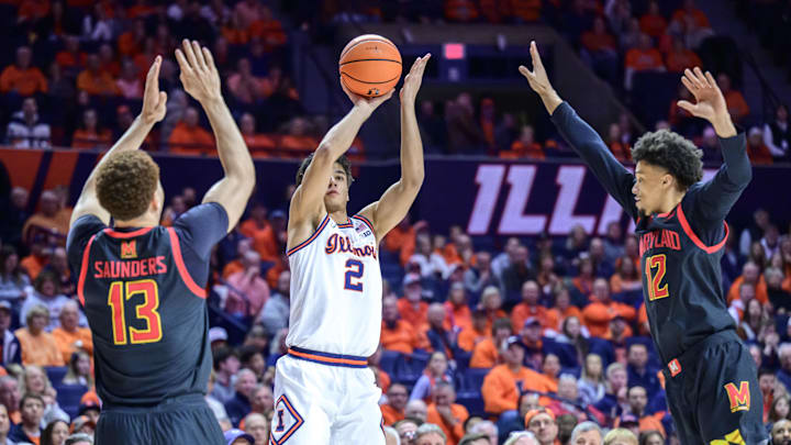 Jan 21, 2026; Champaign, Illinois, USA; Illinois Fighting Illini guard Andrej Stojakovic (2) shoots over Maryland Terrapins forward Elijah Saunders (13) and guard Isaiah Watts (12) during the second half at State Farm Center. Mandatory Credit: Fred Zwicky-Imagn Images