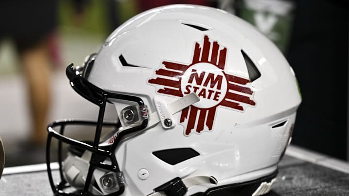 Nov 16, 2024; College Station, Texas, USA; A detail view of a New Mexico State Aggies helmet on the sideline during the game against the Texas A&M Aggies at Kyle Field. Mandatory Credit: Maria Lysaker-Imagn Images 