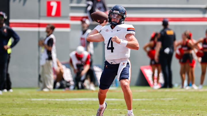 Sep 6, 2025; Raleigh, North Carolina, USA; Virginia Cavaliers quarterback Chandler Morris (4) prepares to throw the football during the first half of the game against North Carolina State Wolfpack at Carter-Finley Stadium. Mandatory Credit: Jaylynn Nash-Imagn Images