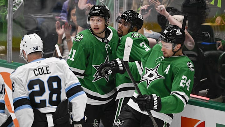 Apr 12, 2025; Dallas, Texas, USA; Dallas Stars left wing Jason Robertson (21) and defenseman Matt Dumba (3) and center Roope Hintz (24) celebrates a goal scored by Robertson against the Utah Hockey Club during the second period at the American Airlines Center. Mandatory Credit: Jerome Miron-Imagn Images