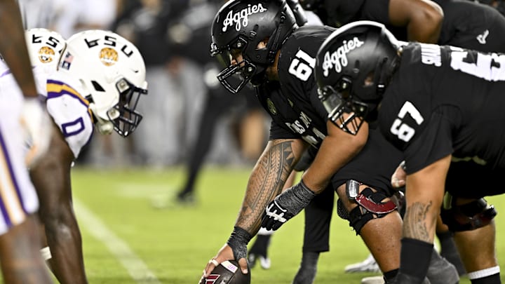 Oct 26, 2024; College Station, Texas, USA; Texas A&M Aggies offensive lineman Kolinu'u Faaiu (61) sets the ball in the fourth quarter against the LSU Tigers at Kyle Field. Mandatory Credit: Maria Lysaker-Imagn Images. 