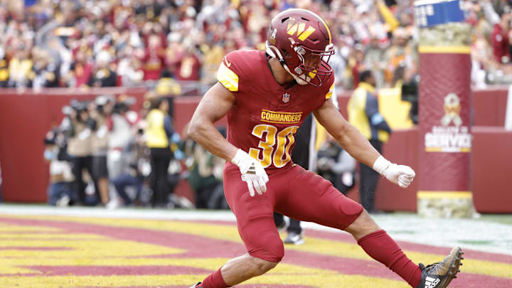 Washington Commanders running back Austin Ekeler (30) celebrates after scoring a touchdown during the first quarter against the Pittsburgh Steelers at Northwest Stadium. Washington Commanders running back Austin Ekeler (30) celebrates after scoring a touchdown during the first quarter against the Pittsburgh Steelers at Northwest Stadium.