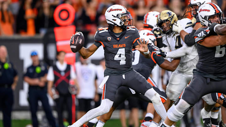 Gevani McCoy prepares to pass against Purdue