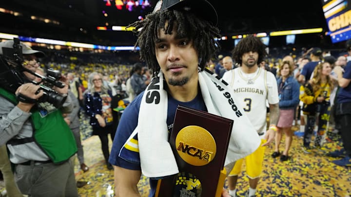 Apr 6, 2026; Indianapolis, IN, USA; Michigan Wolverines guard Elliot Cadeau (3) celebrates after their win against the UConn Huskies in the national championship of the Final Four of the men's 2026 NCAA Tournament between the  and the Michigan Wolverines at Lucas Oil Stadium. Mandatory Credit: Bob Donnan-Imagn Images