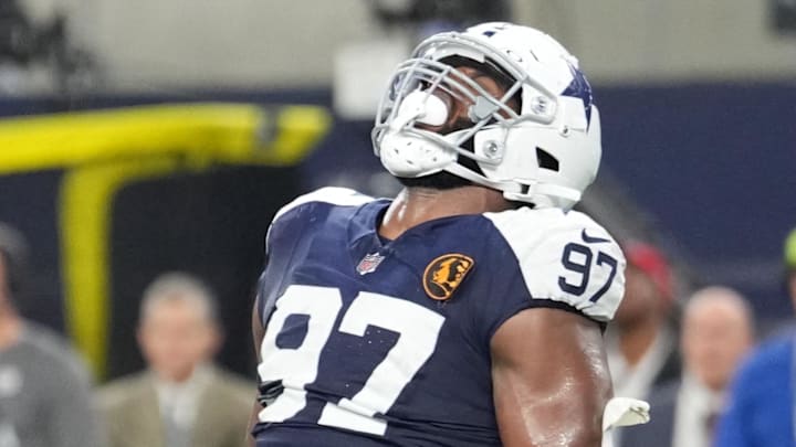 Nov 28, 2024; Arlington, Texas, USA;  Dallas Cowboys defensive tackle Osa Odighizuwa (97) celebrates after a sack against the New York Giants during the second half at AT&T Stadium. Mandatory Credit: Chris Jones-Imagn Images