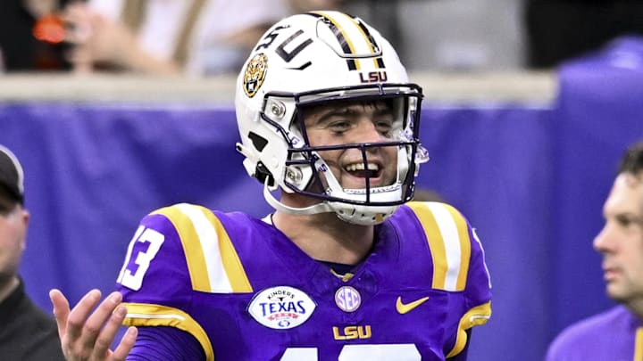 Dec 31, 2024; Houston, TX, USA; LSU Tigers quarterback Garrett Nussmeier (13) reacts after throwing a touchdown pass during the first half against the Baylor Bears at NRG Stadium. The Tigers defeat the Bears 44-31. Mandatory Credit: Maria Lysaker-Imagn Images 